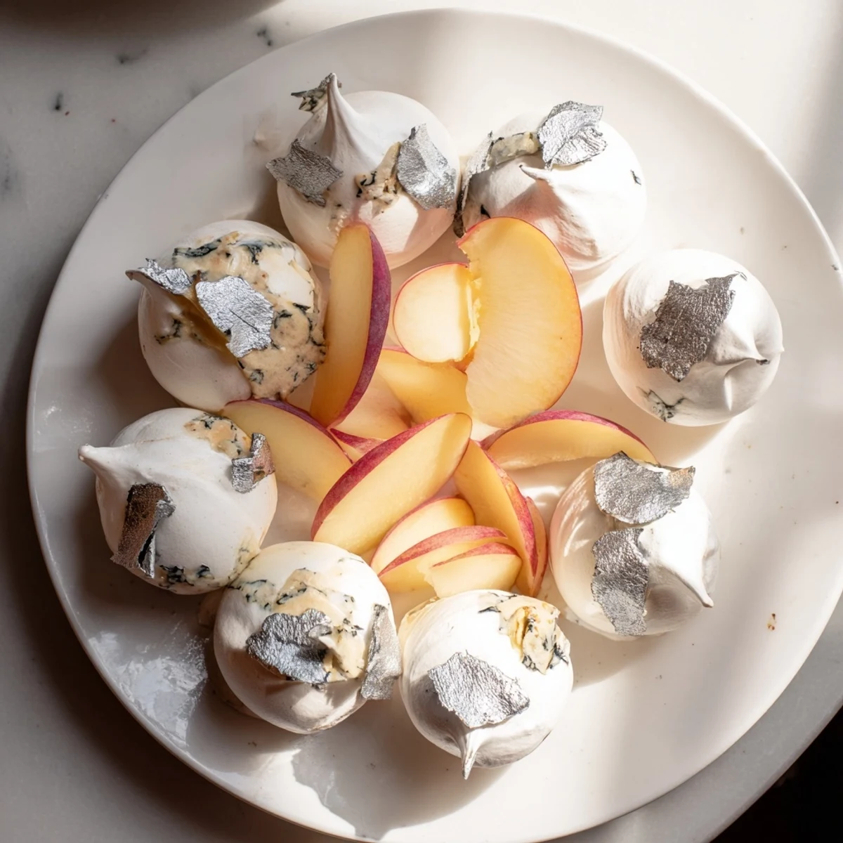 Elegant Pearly Gates cheese board features creamy brie, sweet peaches, and crisp meringue ready to serve.