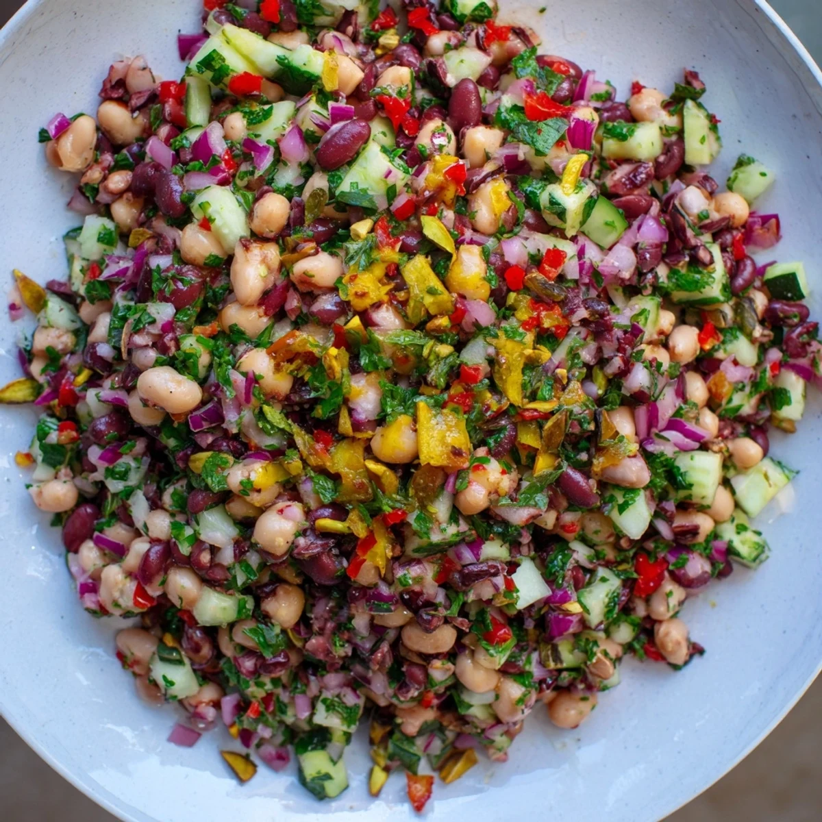 Enjoy a refreshing scoop of the savory Dense Bean Salad with Dubai Chocolate Notes, a fantastic vegetarian option.