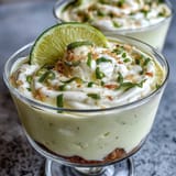 Lemon mousse cups with buttery shortbread crumble and fresh berries, a perfect spring dessert for any occasion.