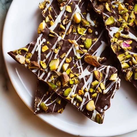 Melted dark chocolate topped with pistachio and phyllo makes this Dubai Chocolate Bark irresistible.