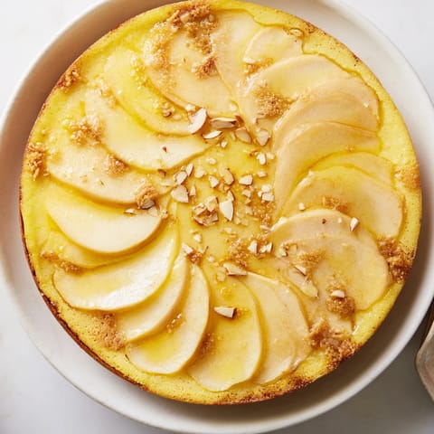 Warm spices and juicy apples in a Rustic Crustless Apple Pie; golden, bubbly, and inviting in its pie dish.