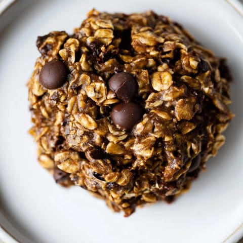 A stack of homemade Chocolate Oatmeal Breakfast Cookies featuring a soft, cake-like texture and rich chocolate taste.