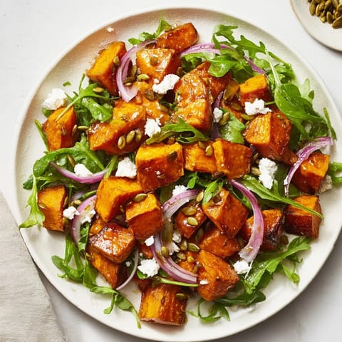 Roasted sweet potato salad with honey-lime dressing and toasted pumpkin seeds for crunch.